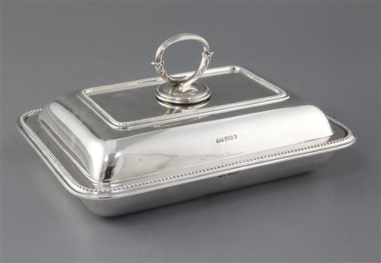 A George V silver rectangular entree dish and cover, Sheffield 1923, makers Walker & Hall, 56 oz.